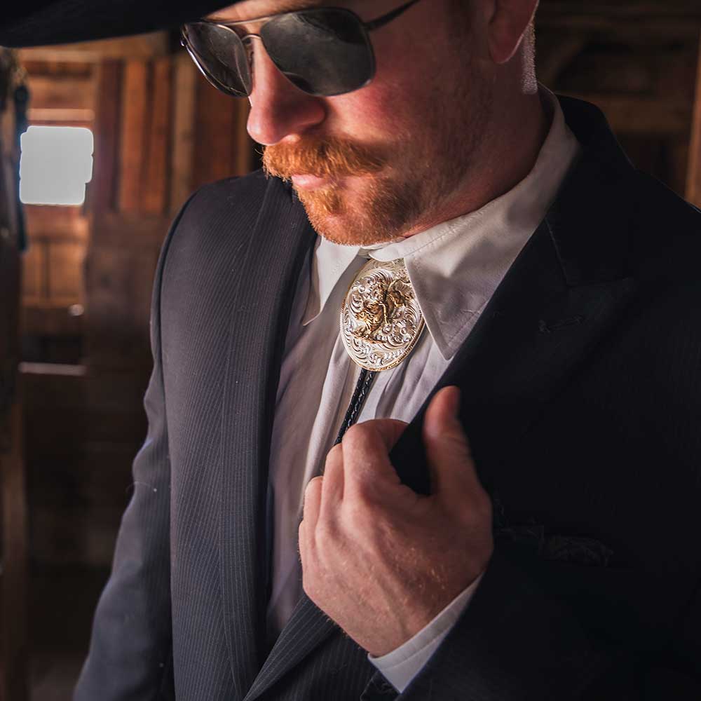 MONTANA SILVERSMITHS EXTRA LARGE BOLO TIE WITH BULL RIDER